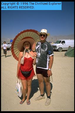 A nice couple with a nice parasol.