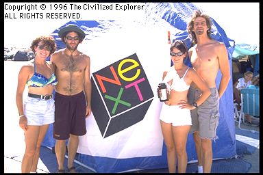 Four people with the NeXT logo