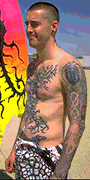 Baroque scrolling on his tattoos.