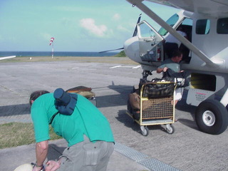 Baggage is loaded and unloaded the old-fashioned way.