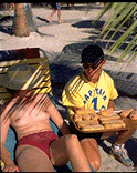 A donut is offered to a tourist.