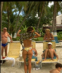 A vendor sells clothes on the beach